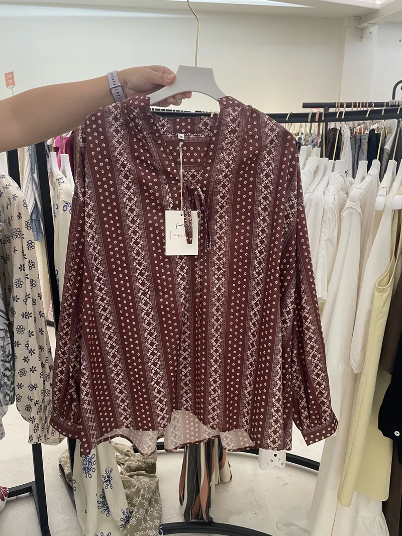 Burgundy Geometric Print V-Neck Blouse — Tops & Tees by NEWCOM women's wear manufacturer