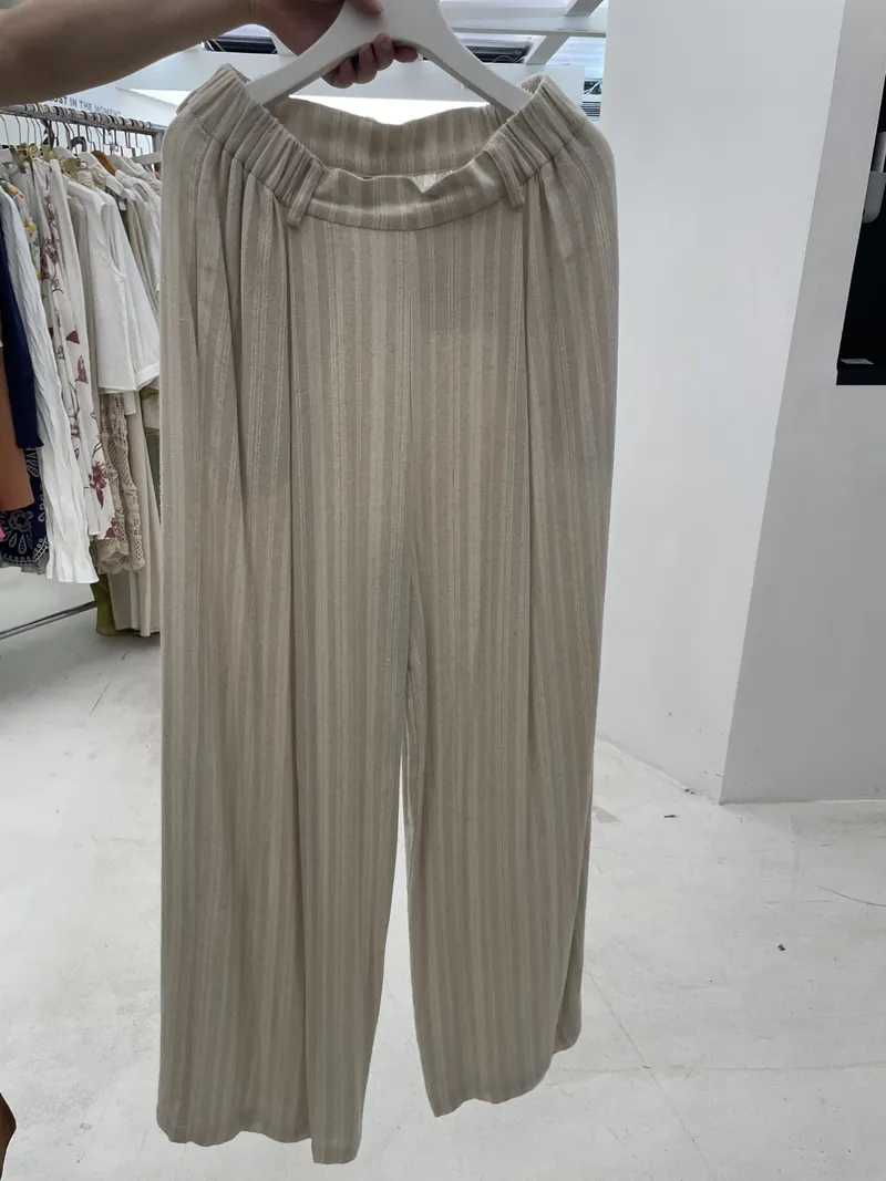 Taupe Pleated Wide-Leg Pants — Skirts & Pants by NEWCOM women's wear manufacturer